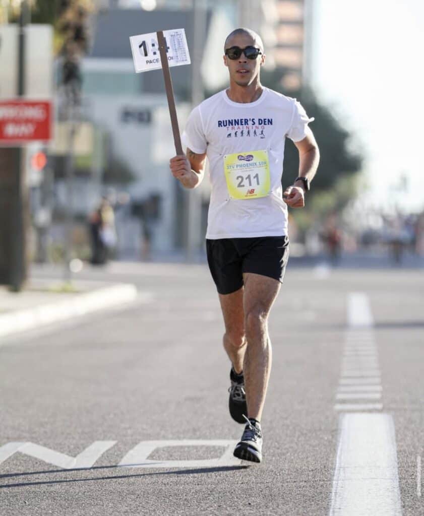 Active runner participating in a marathon race, demonstrating professional coaching and training.