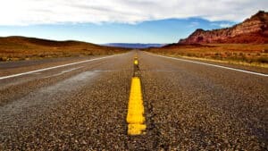 Scenic open road in a desert landscape, perfect for marathon or running training sessions.